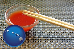 hawaii map icon and chopsticks and red hot sauce in a Chinese restaurant