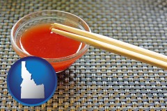 idaho map icon and chopsticks and red hot sauce in a Chinese restaurant