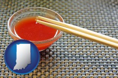 indiana map icon and chopsticks and red hot sauce in a Chinese restaurant