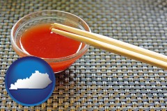 kentucky map icon and chopsticks and red hot sauce in a Chinese restaurant