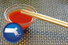 massachusetts map icon and chopsticks and red hot sauce in a Chinese restaurant
