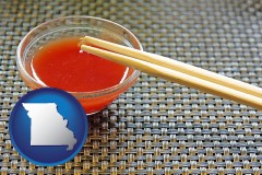 missouri map icon and chopsticks and red hot sauce in a Chinese restaurant