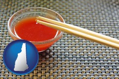 new-hampshire map icon and chopsticks and red hot sauce in a Chinese restaurant