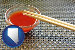 nevada map icon and chopsticks and red hot sauce in a Chinese restaurant