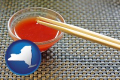new-york map icon and chopsticks and red hot sauce in a Chinese restaurant