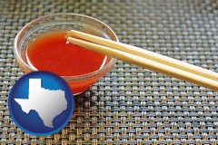 texas map icon and chopsticks and red hot sauce in a Chinese restaurant