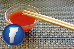 vermont map icon and chopsticks and red hot sauce in a Chinese restaurant