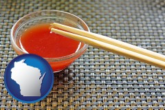 wisconsin map icon and chopsticks and red hot sauce in a Chinese restaurant