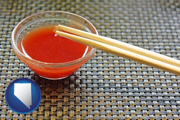 chopsticks and red hot sauce in a Chinese restaurant - with Nevada icon
