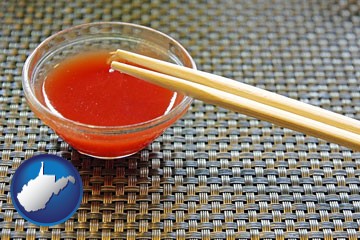 chopsticks and red hot sauce in a Chinese restaurant - with West Virginia icon