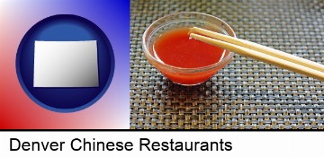 chopsticks and red hot sauce in a Chinese restaurant in Denver, CO