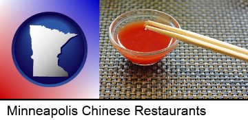 chopsticks and red hot sauce in a Chinese restaurant in Minneapolis, MN