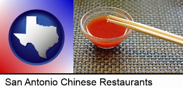 chopsticks and red hot sauce in a Chinese restaurant in San Antonio, TX