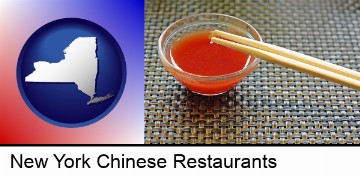 chopsticks and red hot sauce in a Chinese restaurant in New York, NY